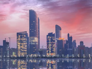 Photo sur Plexiglas moyen-Orient Skyscrapers in the evening, Abu Dhabi, United Arab Emirates