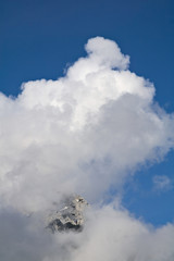foggy clouds rising from dark mountain forest