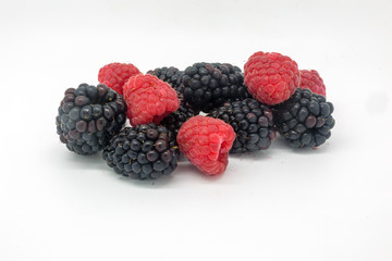 Blackberries and Raspberries against a white background