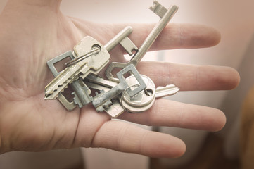 Man’s hand with lot’s of keys, secrets… 