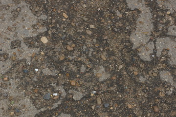 the texture of the old asphalt. small pebbles crack grunge