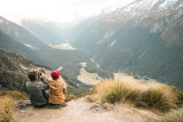 New Zealand: photo of young lovely couple in top of mountains 