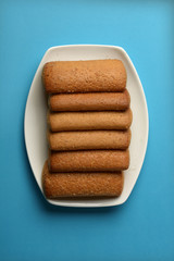 row of shortbread biscuits in white saucer