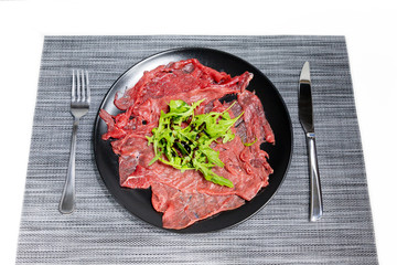 Carpaccio of Italian beef with rocket salad, parmesan and Modena balsamic vinegar cream