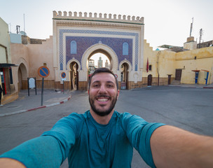 happy man tourist take selfie photo in Fez, Morocco