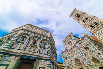 travel to Italy - Florence Baptistery (Battistero di San Giovanni, Baptistery of Saint John) and Duomo Cathedral Santa Maria del Fiore with Giotto's Campanile on Piazza San Giovanni in morning