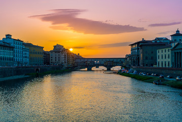 Florence, Italy. River Arno and famous bridge Ponte Vecchio at sunset from Piazzale Michelangelo in...
