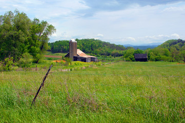 Fototapeta na wymiar Double Set of Barns With A View