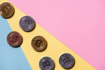 top view of arranged various bitcoins on colorful background