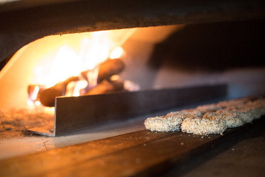 Bagels baking in a wood fired oven