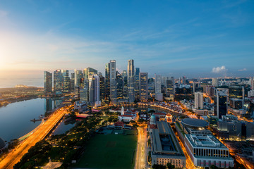 Fototapeta na wymiar Aerial view of Singapore business district and city at twilight in Singapore, Asia.