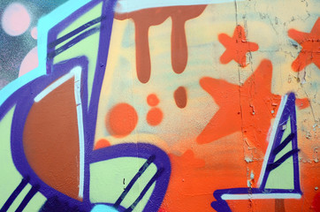 Street art. Abstract background image of a fragment of a colored graffiti painting in beige and orange tones