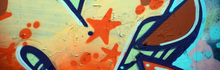 Street art. Abstract background image of a fragment of a colored graffiti painting in beige and orange tones