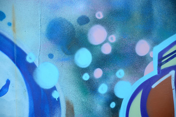 Street art. Abstract background image of a fragment of a colored graffiti painting in cosmic blue and violet tones