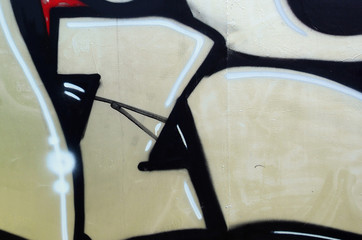 Street art. Abstract background image of a fragment of a colored graffiti painting in chrome and...