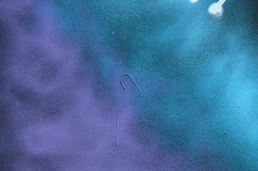 Street art. Abstract background image of a fragment of a colored graffiti painting in cosmic blue...