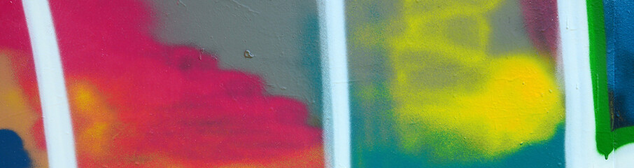 Street art. Abstract background image of a fragment of a colored graffiti painting in fashionable colors