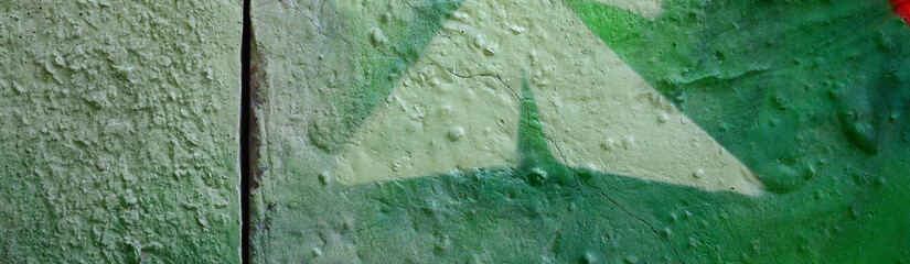 Street art. Abstract background image of a fragment of a colored graffiti painting in khaki green...