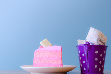 pink cake and  Tissue in tank on blue background,break time,select focus.