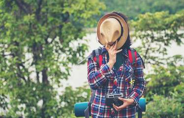 Fototapeta premium Female tourist with backpack on the hill 