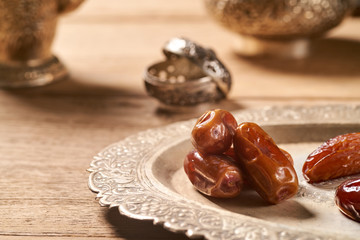 sweet dried dates fruit on metal tray