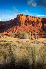 Sierkussen Natuurpark American Southwest Desert Landscape. Classic eroded Navaho sandstone bluffs and blue skies bring up an image of the old west. This is especially true here in Torrey, Utah, near Capitol Reef Park.  © LoweStock