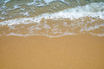 Fototapeta na wymiar Soft wave of ocean on sandy beach-2