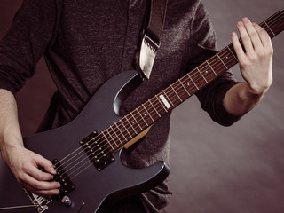 Fototapeta na wymiar Male hands playing electric guitar
