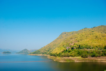 Fototapeta premium Kaeng Krachan Dam In Petcahburi At Thailand , Landscape Natrue and a water mist at Kaeng Krachan Dam.
