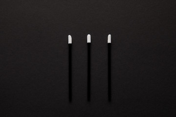 top view of three brushes for permanent makeup isolated on black