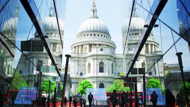 LONDON - MAY, 2017: Pedestrians walking between modern buildings towards St Paul&rsquo;s Cathedral, London, EC4