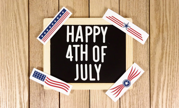 Happy 4th of July Typography Over Wood Background. Photo image