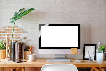 Contemporary  workspace desk with desktop computer, office accessory, blank screen computer and...