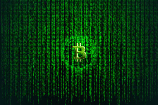 Bitcoin metallic coin with binary code of matrix effect background.