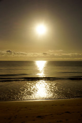 Fototapeta premium Early Morning Sunrise reflecting on the water on Waimanalo Beach