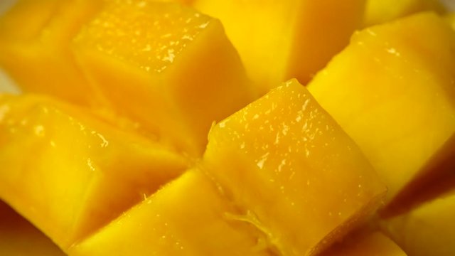 Rotation of rip mango slice cubes cut