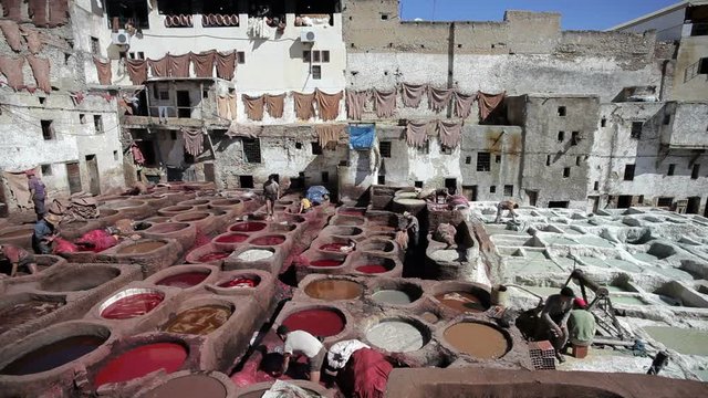 Chouwara traditional leather tannery in Old Fez, vats for tanning and dyeing leather hides and skins, Fez, Morocco, North Africa