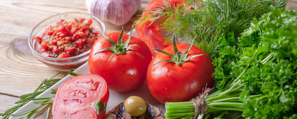 Fresh vegetables and herbs. Red tomatoes, red sweet peppers, parsley, dill, arugula, garlic, rosemary. Bio healthy food concept. Banner
