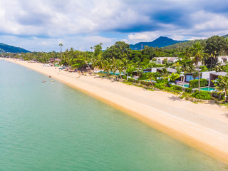 Aerial view of beautiful tropical beach and sea with palm and other tree in koh samui island