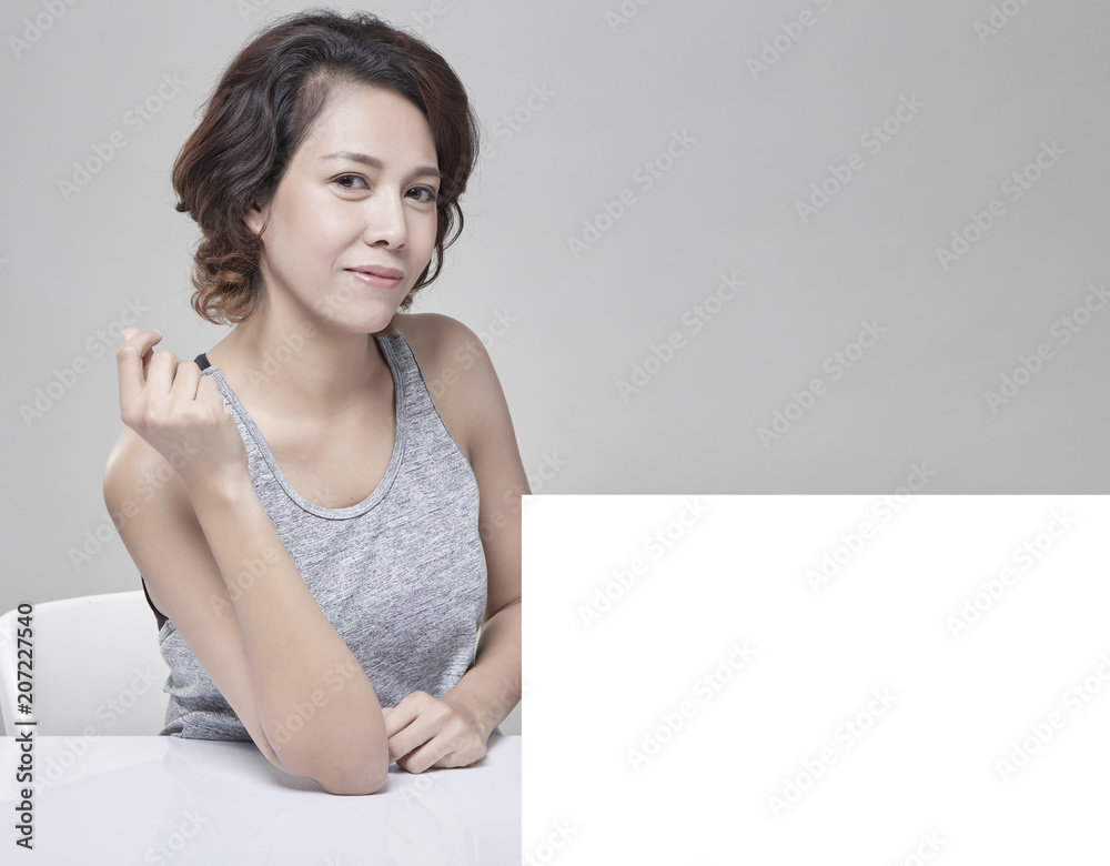 Wall mural woman beautiful and healthy woman with a blank banner