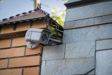 Street surveillance camera on the fence.