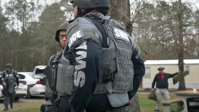 SWAT team officers prepare for counterterrorism exercises.