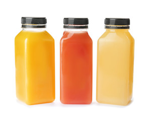 Bottles with fresh juices on white background