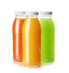 Fototapeta na wymiar Bottles with fresh juices on white background