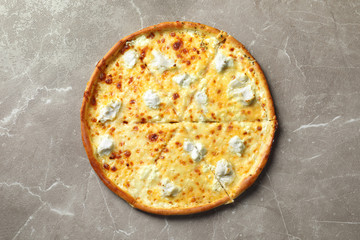 Delicious cheese pizza on grey background, top view