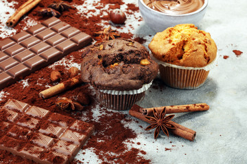 Chocolate muffin and nut muffin, homemade bakery on grey background