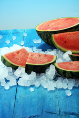 watermelon on blue background. juicy summer fruit in slices