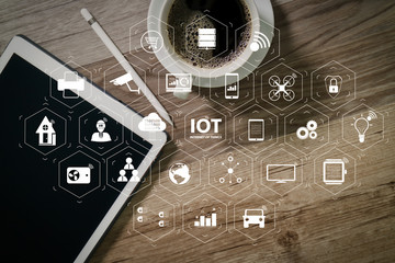 Coffee cup and Digital table dock smart keyboard,eyeglasses,stylus pen on wooden table,filter effect