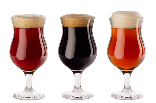 Set  of different beer in wineglasses with foam - lager, red ale, porter -  isolated on white background.