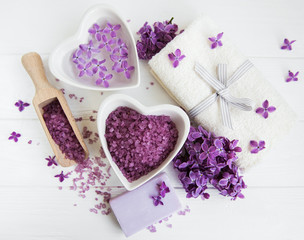 Spa towel and massage products with lilac flowers